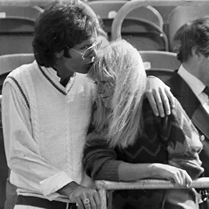 Sue Barker and Cliff Richard kissing in stands at tennis tournament - June 1983