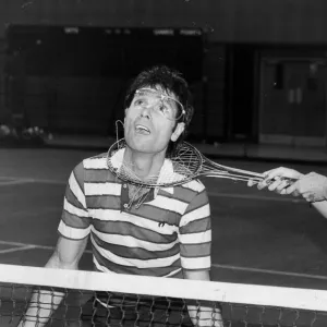 Sue Barker fooling around with Cliff Richard at doubles tennis match - December 1986