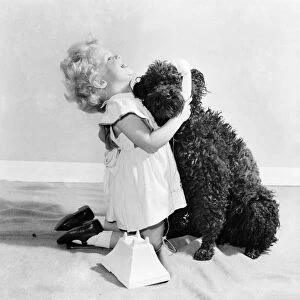 Susan Phillips seen here bathing her poodle Andy. November 1953 D6816-001