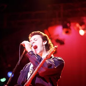 Tears For Fears Lead singer Roland Orzabal singing on stage