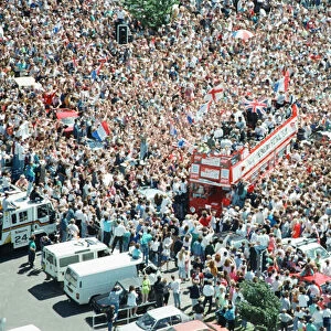 Thousands of England football fans line the streets near Luton airport to welcome their