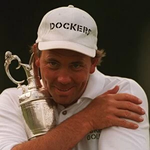 Tom Lehman hugs Claret jug trophy after winning British Open golf championship at Lytham