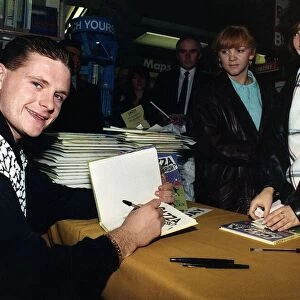 Tottenham and England footballer Paul Gascoigne signing copies of his book