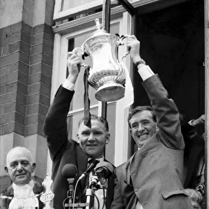 Tottenham Hotspur team captain Danny Blanchflower and manager Bill Nicholson hold the FA