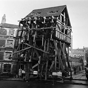 A Tudor house is moved to a new location within Exeter, Devon. 12th December 1961