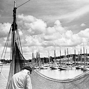 The Tunny fleet seen here repairing theire nets at Concarneau Brittany France. March 1938