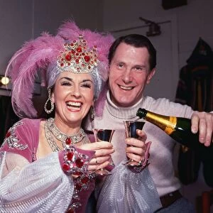Una McLean actress comedienne in costume drinking champagne