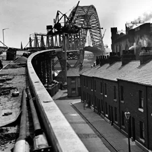 An unusual view of the Widnes-Runcorn Bridge, now almost completed