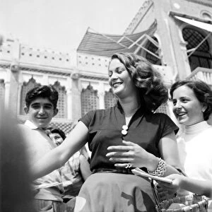 Venice Film Festival 1953. Italian film actress Jaqueline Collard being mobbed by