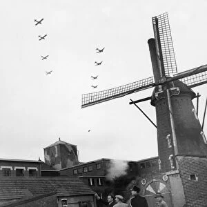Villagers of Valkenswaard, south of Eindhoven, Holland, watch Allied aircraft