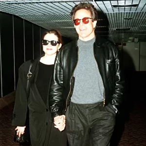 Warren Beatty actor with wife Annette Bening actress arrive at Heathrow airport
