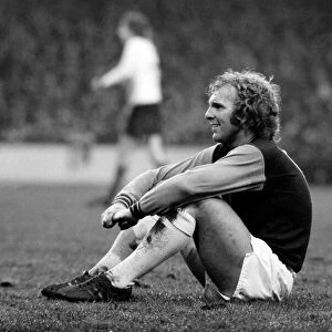 West Ham vs. Liverpool: Bobby Moore takes a rest during an injury to a Liverpool player