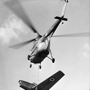 In his Whirlwind helicopter up went Flight Lt. Jimmy Stuart of the joint experimental