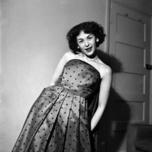 Woman in dress posing for the camera. March 1952 C1581-002