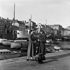 Two women chatting by the Quayside in Douglas, Isle of Man. 13th May 1954