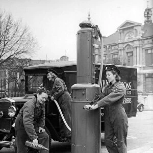 Women Garage Workers filling van with petrol in 1941 women doing mens jobs during