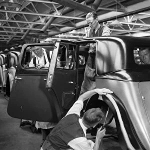 Workers on the Gloria assembly line in the Triumph car factory in Coventry