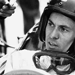 World champion racing driver Jim Clark wearing his helmet