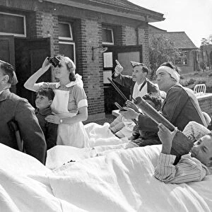 World War II: Hospitals. Nurses and patients watch the dogfights between the R. A. F
