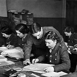 World War II: Women. Members of the ATS take over the pay corps work freeing up men to