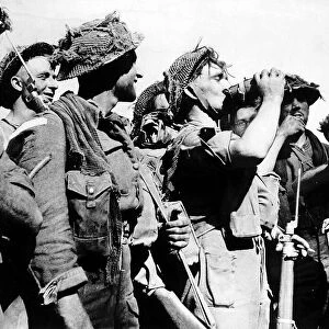 WW2 British soldier drinks from his waterbottle 1944