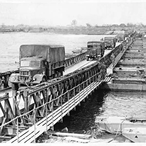 WW2 - March 1945 Allied army trucks crossing the Bailey pontoon bridge over the Rhine