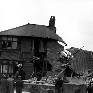 WW2 York Air Raid Bomb Damage Civilians and rescue workers search through a bomb