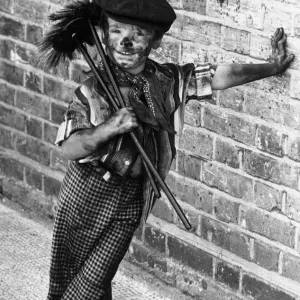 Four year old chimney sweep Tommy Stafford in fancy dress to celebrate the 100th