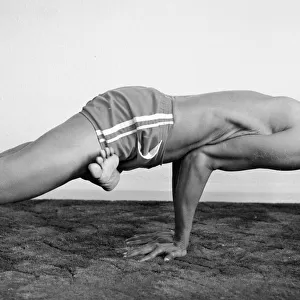 Yoga positions. Position is called Lotus in Peacock (Padma Mayurasana