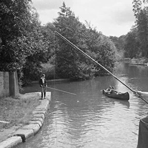 A young angler fishing in the Grand Union Canal between Rickmansworth and Watford