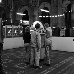 Three young boys pictured in the amusement arcades. Scarborough, North Yorkshire