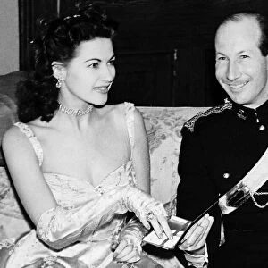 Yvonne De Carlo accepting cigarette from case actress Ninth Earl of Lanesborough
