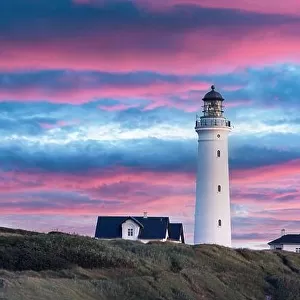 Amazing pink sunset view of Hirtshals lighthouse in Denmark. Landscape photography