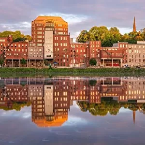Augusta, Maine, USA downtown skyline on the Kennebec River at twilight