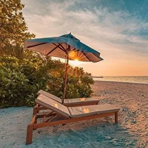 Beautiful sunset relax beach. Chairs on sandy beach near the sea. Summer holiday and vacation concept for tourism. Inspire romance tropical landscape