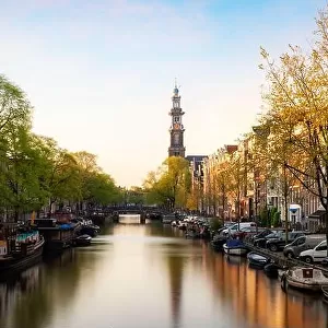 Canals of Amsterdam during sunset in Netherlands. Amsterdam is the capital and most populous city of the Netherlands. Landscape and culture travel, or