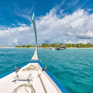 Inspirational Maldives beach design. Maldives traditional boat Dhoni and perfect blue sea with lagoon. Luxury tropical paradise concept