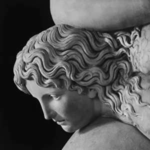 Cupid gripping a dolphin, detail of Cupid's head: Roman copy from Capua, in the National Archaeological Museum of Naples
