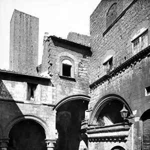 Facade of the Palazzo degli Alessandri, Viterbo. The stones, likely the remains of a recent collapse, are visible on the left