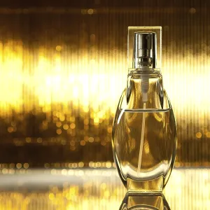 Una botella de perfume sobre un fondo dorado abstracto. Una botella de perfume sobre un fondo dorado abstracto.