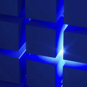 Estructuras cúbicas crean un atractivo arreglo geométrico destacado por la luz azul. Estructuras cúbicas crean un atractivo arreglo geométrico destacado por la luz azul.