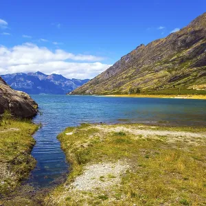 Journey to the ends of the world. South Island, New Zealand. Mountains surround the magnificent Hawea Lake. The concept of ecological, active and photo tourism