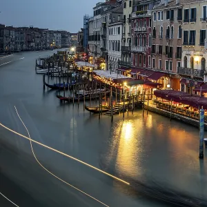 View of the Canale Grande with illuminated restaurants at night