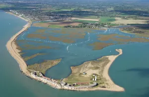 Prints of HURST CASTLE, Hampshire. Aerial view of the castle showing its position on the spit Castle Prints: Hurst Castle Aerial Print