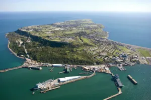 Prints of PORTLAND PORT AND THE ISLE OF PORTLAND, Dorset. Aerial view. Connected to the mainland by Chesil Beach this limestone island is a central feature on the Jurassic Coast Explore South West England: Coast, Countryside and Travel: Aerial View of Portland Harbour Print