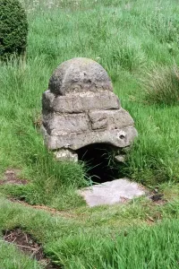 Prints of Harelaw Watering Place, North Road, Stanley, County Durham. A rounded pyramidal stone marks the springhead County Durham Prints: Harelaw Watering Place Print: A stone marker at the springhead