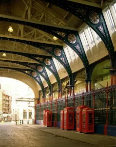Prints of SMITHFIELD MARKET, City of London. Interior view of Grand Avenue with red K2 and K6 type telephone kiosks Related Prints: Smithfield Market Print: Interior View of Grand Avenue