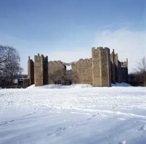 Prints of FRAMLINGHAM CASTLE, Suffolk. The castle in snow. Exterior view looking north from the bailey Suffolk Prints: Framlingham Castle Print in Snow