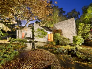 Prints of New House, Shipton Under Wychwood, Oxforshire. 1964 by Stout and Litchfield. General view of exterior to house with Japanese garden at twilight. NHLE 1375658 Brutalist Architecture Prints: Print of a house exterior with Japanese garden at twilight