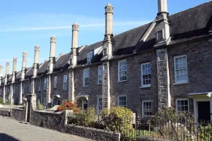 Prints of Vicars Close, Wells, Mendip, Somerset. A mid-14th century terrace of houses with 15th century chimney shafts in Vicars Close Architecture in England - Historic and Modern Buildings: Vicars Close Print: 14th century Wells houses